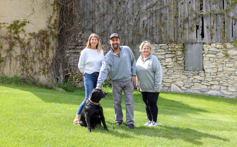 Lance Nelson stands with his wife, Meredyth (left), and her sister Heather Smith.
